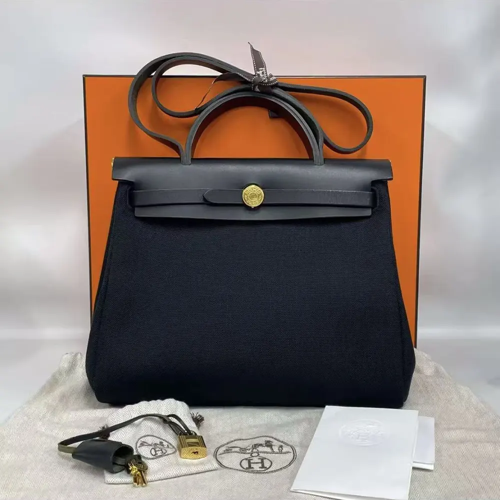 Close-up on gold zip hardware of Hermes Women Herbag Zip 31 Bag