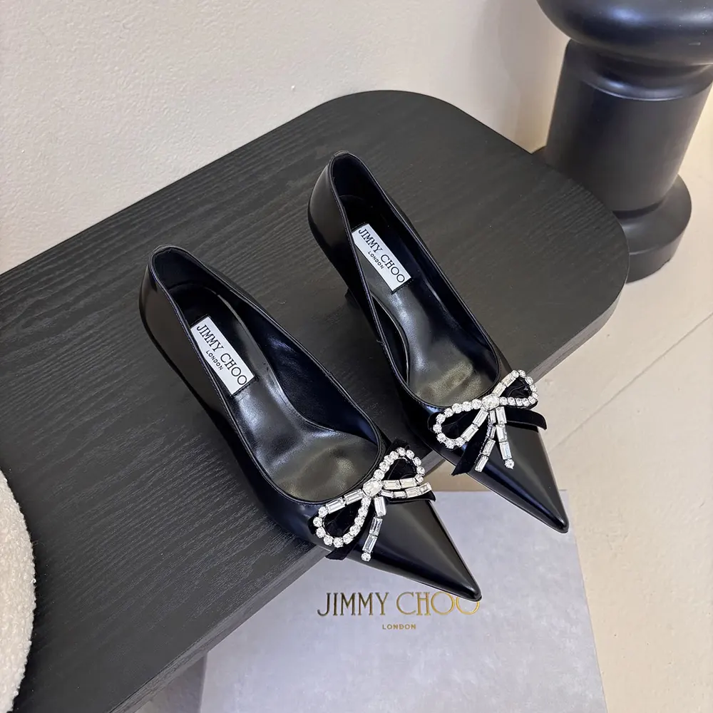 Close-up of velvet and crystal bow on Jimmy Choo Women Auria pumps