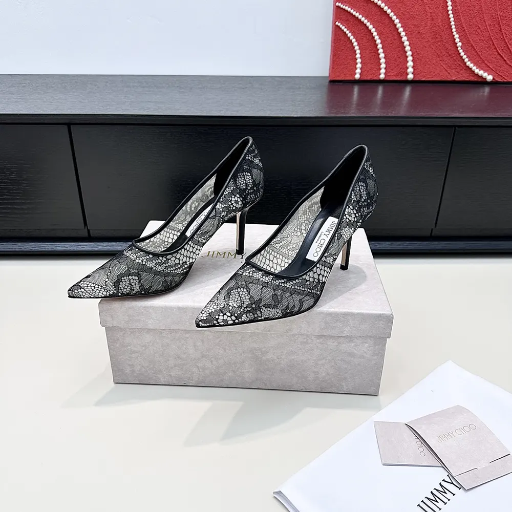 Back angle showing stiletto heel and signature logo on Romy 85 pumps