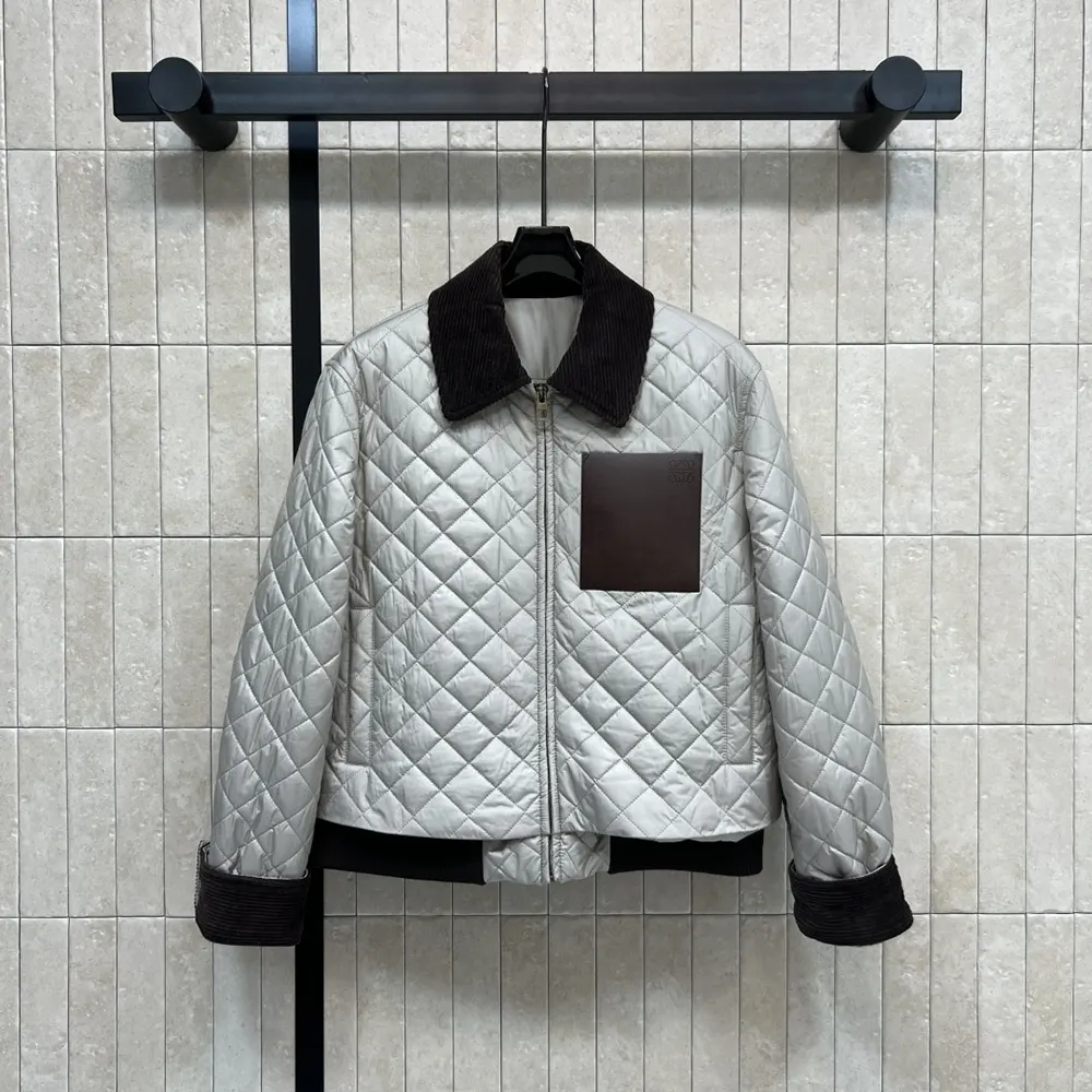 Close-up of embossed hardware detail on Loewe Women Short Jacket