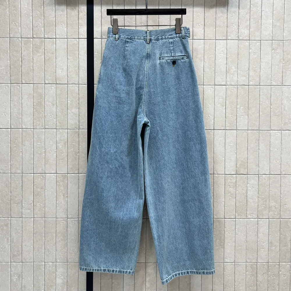 Side angle showing draped silhouette of Loewe Women Draped Jeans