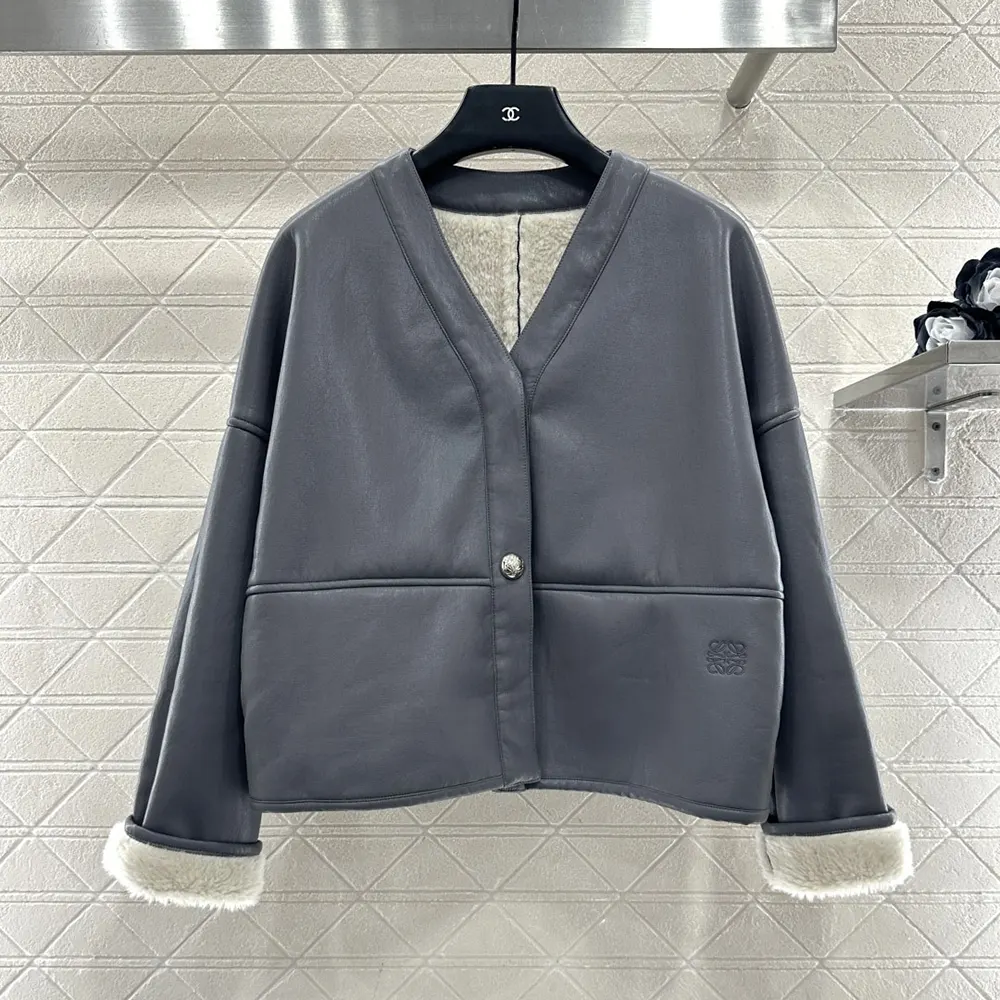 Close-up detail of shearling texture and embossed Loewe hardware