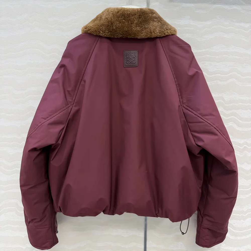 Side profile showing relaxed silhouette of Loewe Men Puffer Burgundy coat
