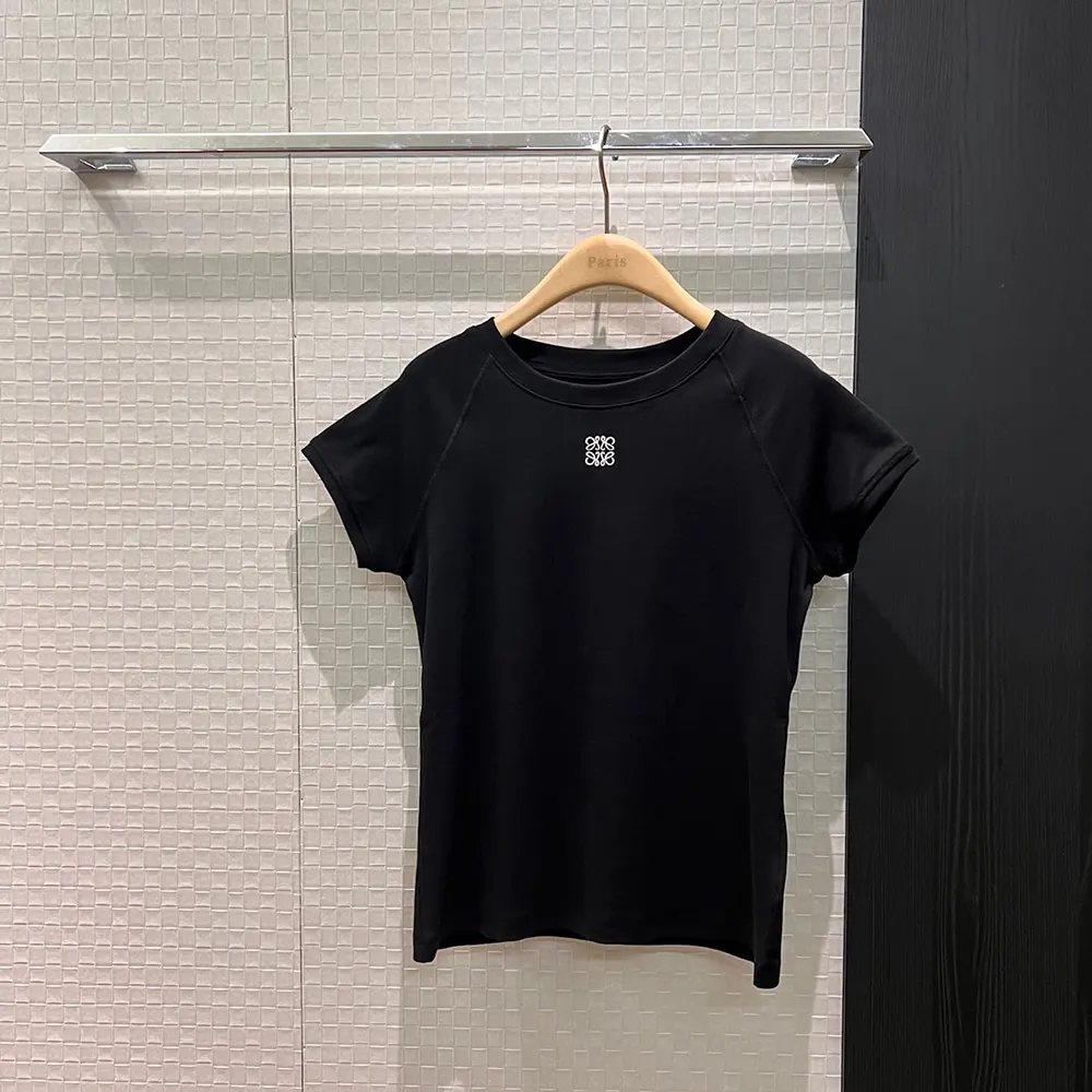 Close-up of black cotton blend fabric and Loewe logo detail