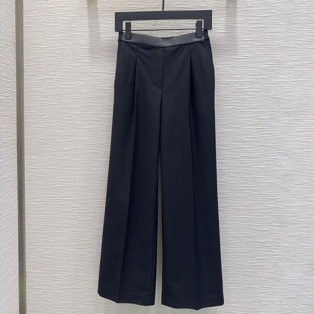 Close-up on waistband and embossed Loewe logo detail on trousers