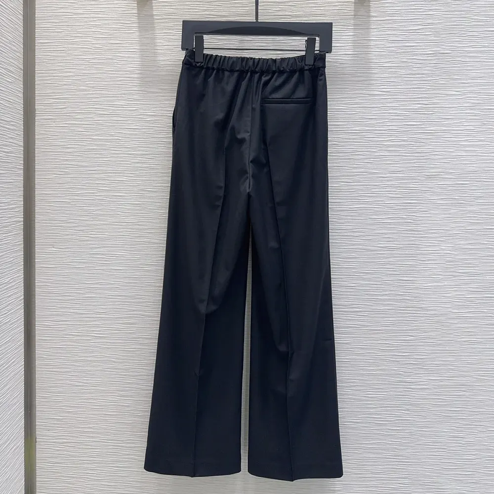 Side angle highlighting straight-leg cut of Loewe Women Trousers in Wool-Black