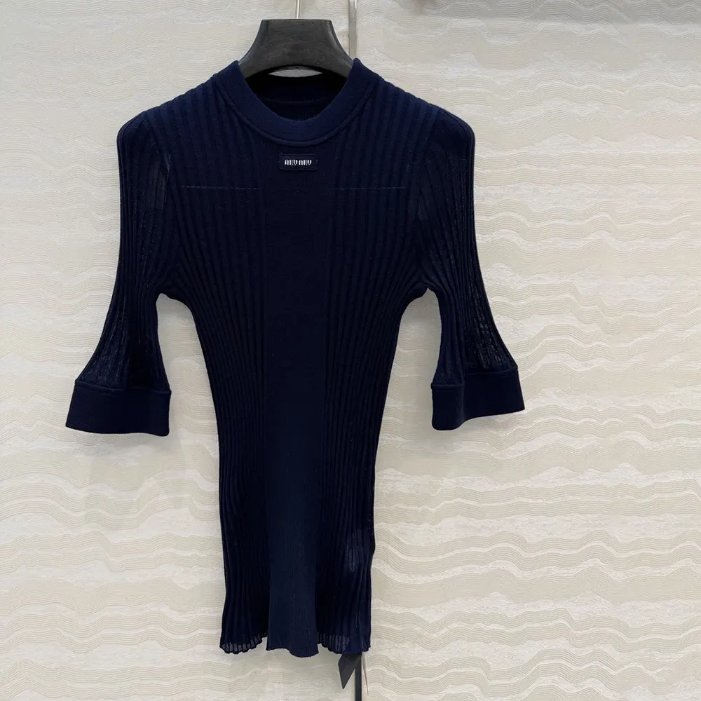 Side angle showing silhouette of Miu Miu Women Ribbed Knit Wool Sweater