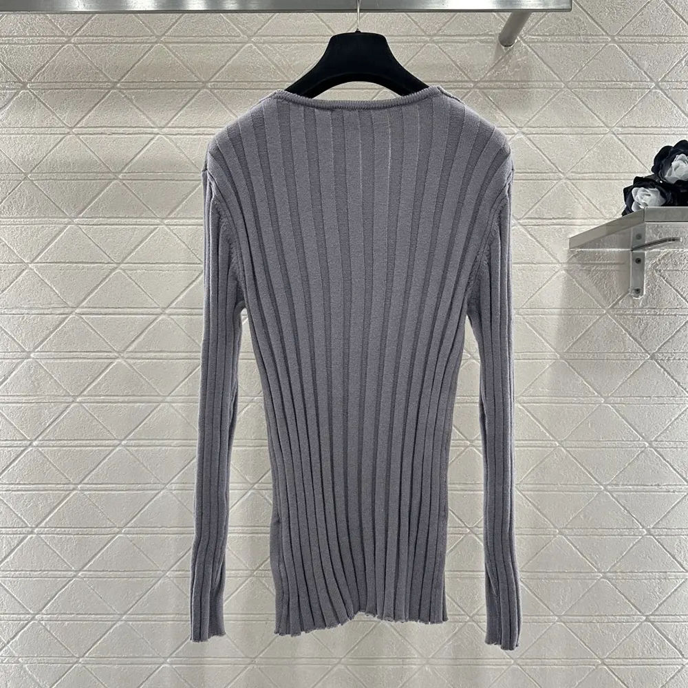 Side angle showing fit and silhouette of Miu Miu wool-cashmere sweater