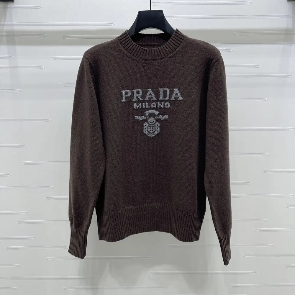 Close-up of dark brown cashmere and wool fabric on Prada crew-neck sweater