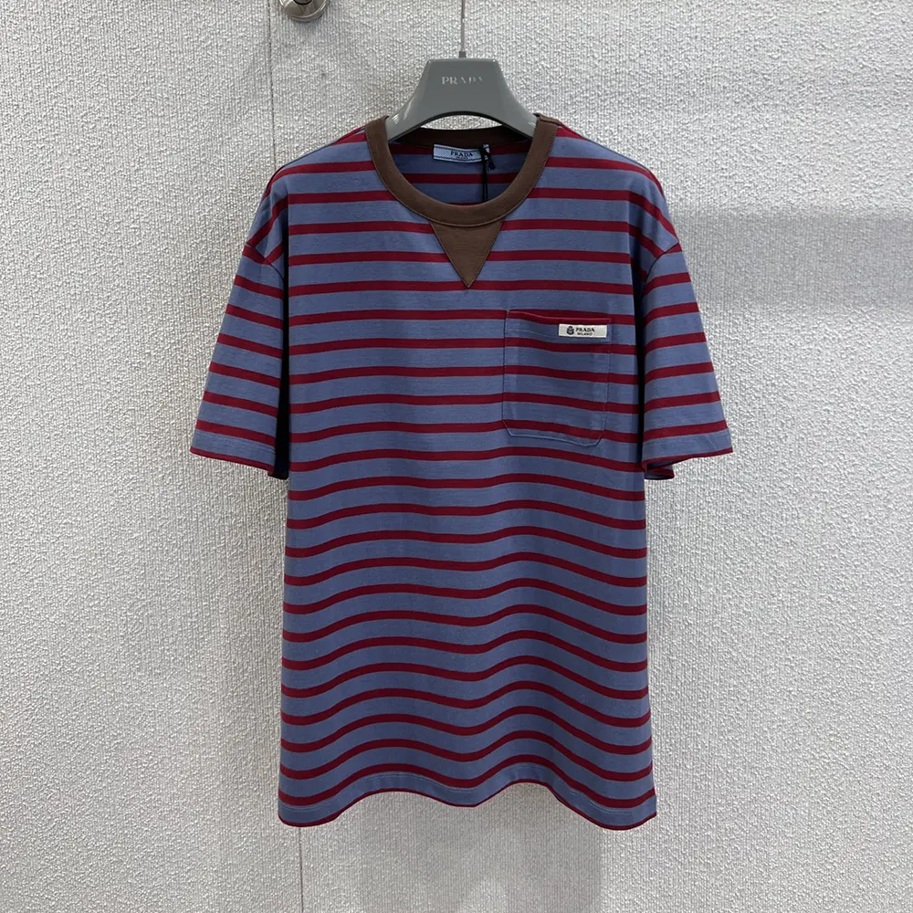 Close-up of brown stripes and Prada logo on oversized striped t-shirt