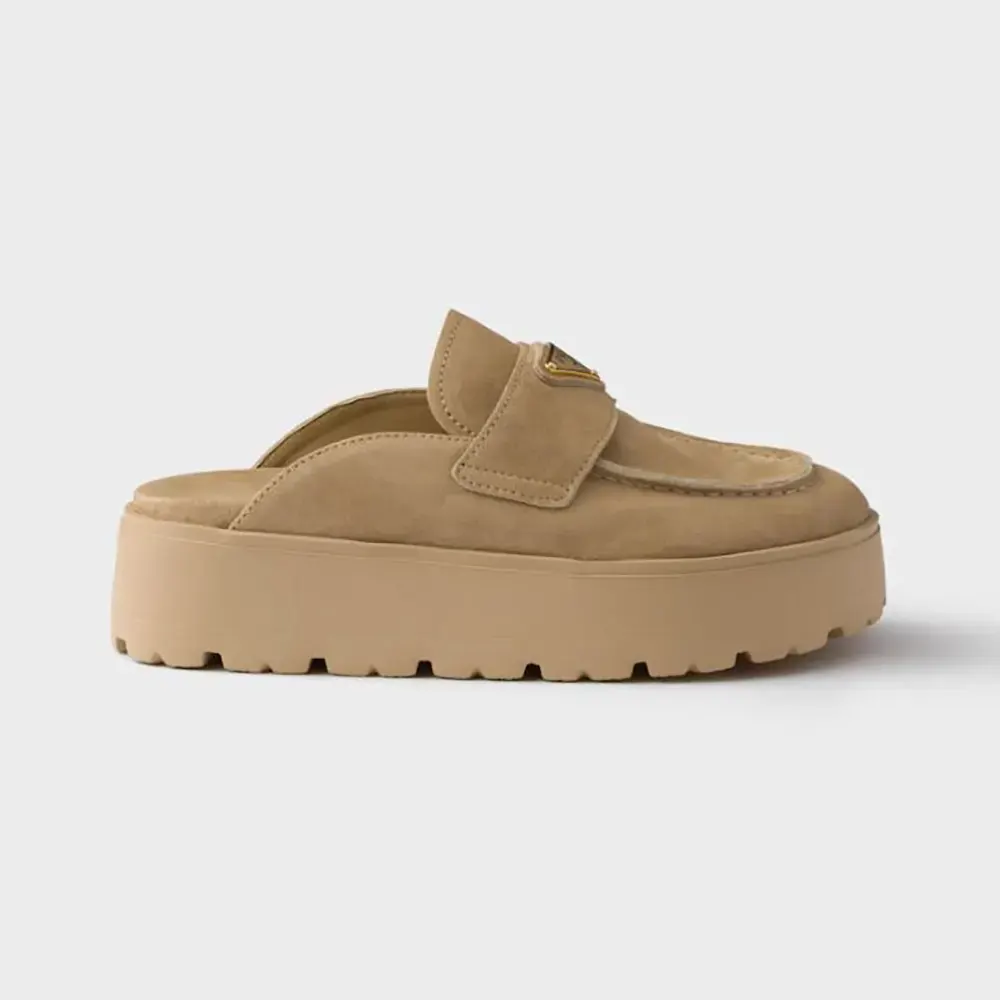 Side view of Prada Women Suede Flatform Mules with triangle logo