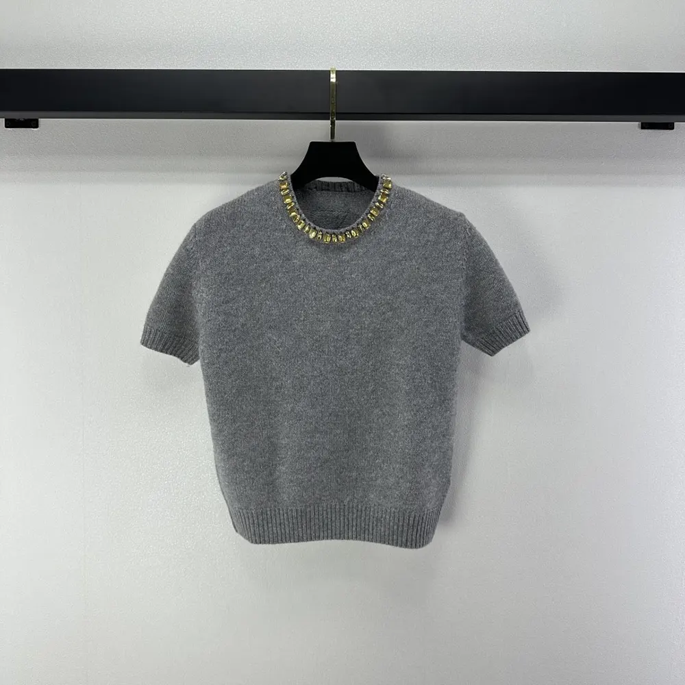 Side angle showing fit and silhouette of Prada Women Wool And Cashmere Crew-Neck Sweater-Grey