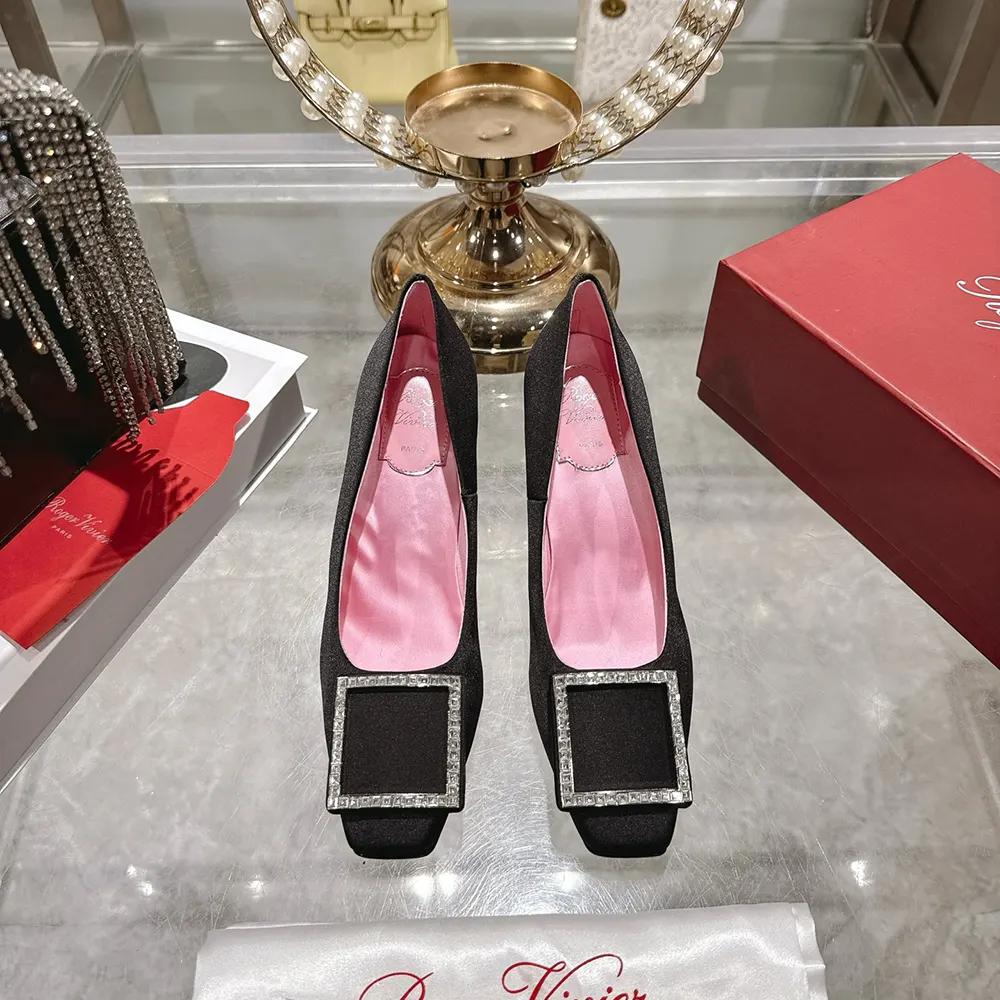 Close-up of silver buckle on Roger Vivier Women Trompette Pumps