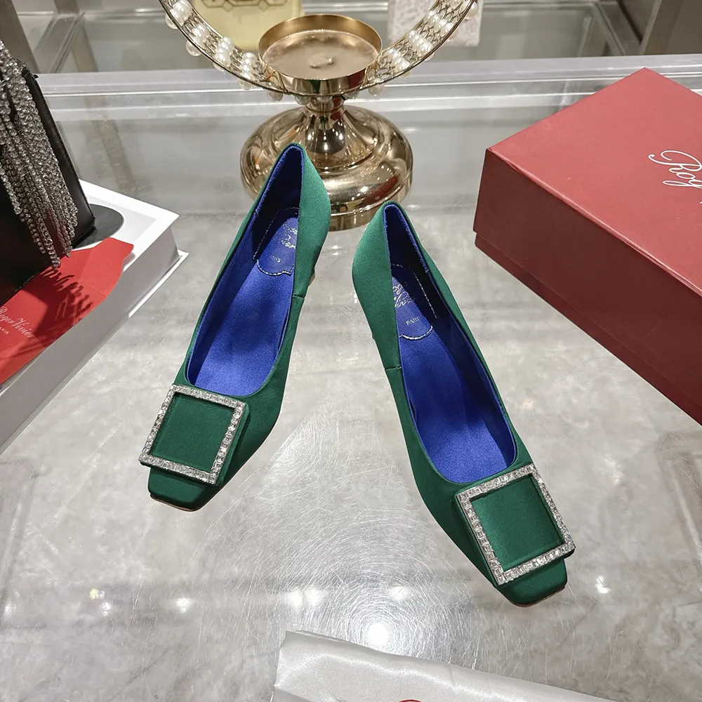 Top-down detail of satin texture on Roger Vivier Trompette Pumps