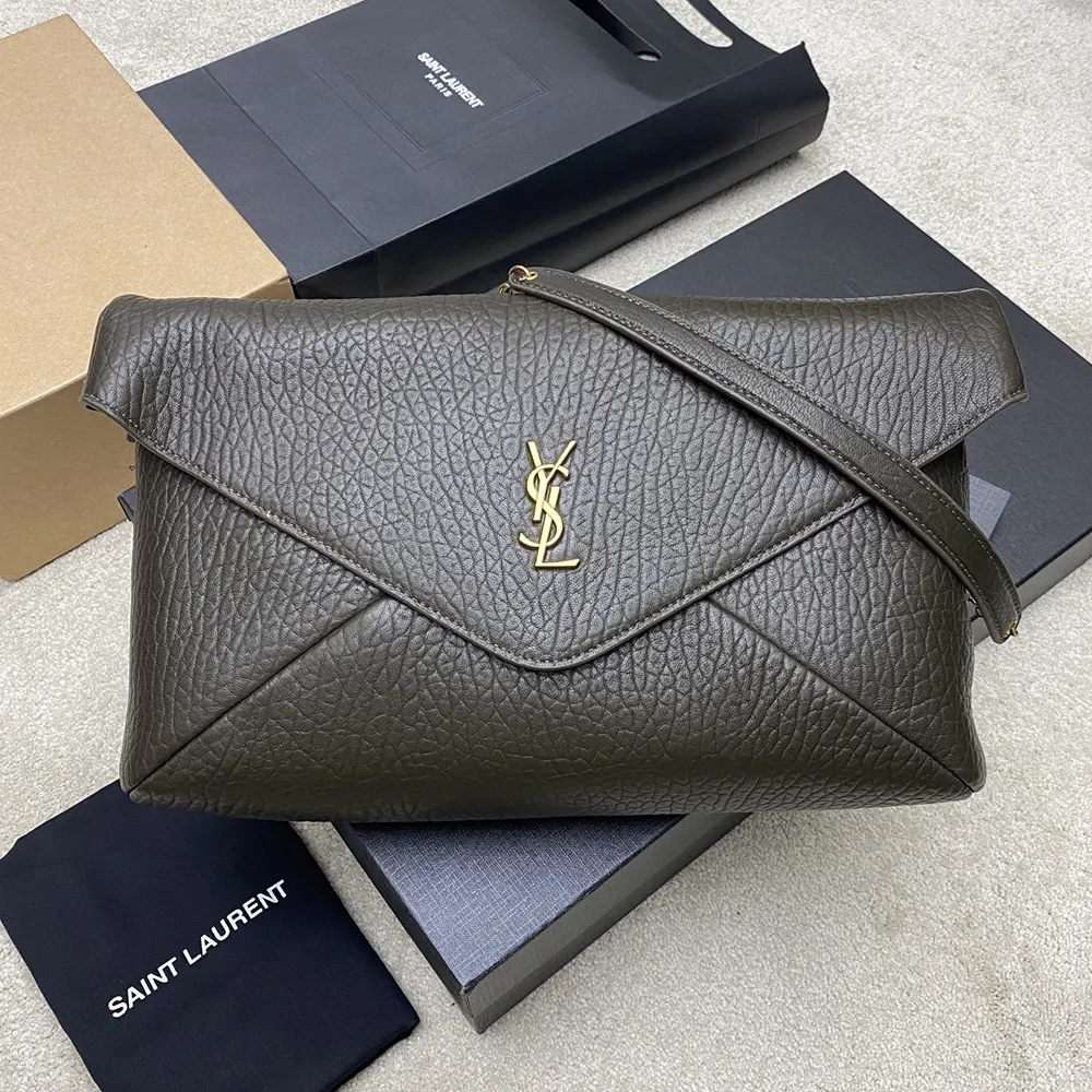 Close-up of gold YSL hardware on Saint Laurent Cassandre XXL pouch