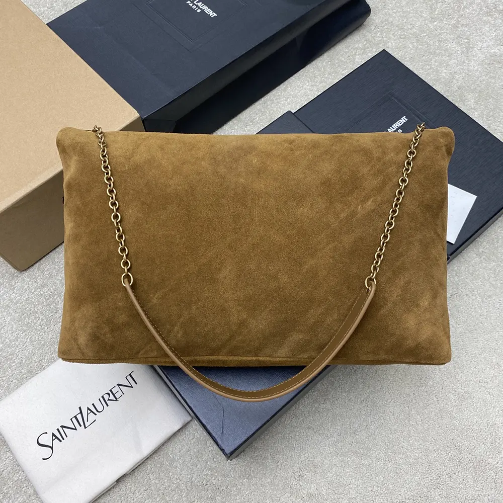Side angle showing chain strap and zip closure on Saint Laurent pouch