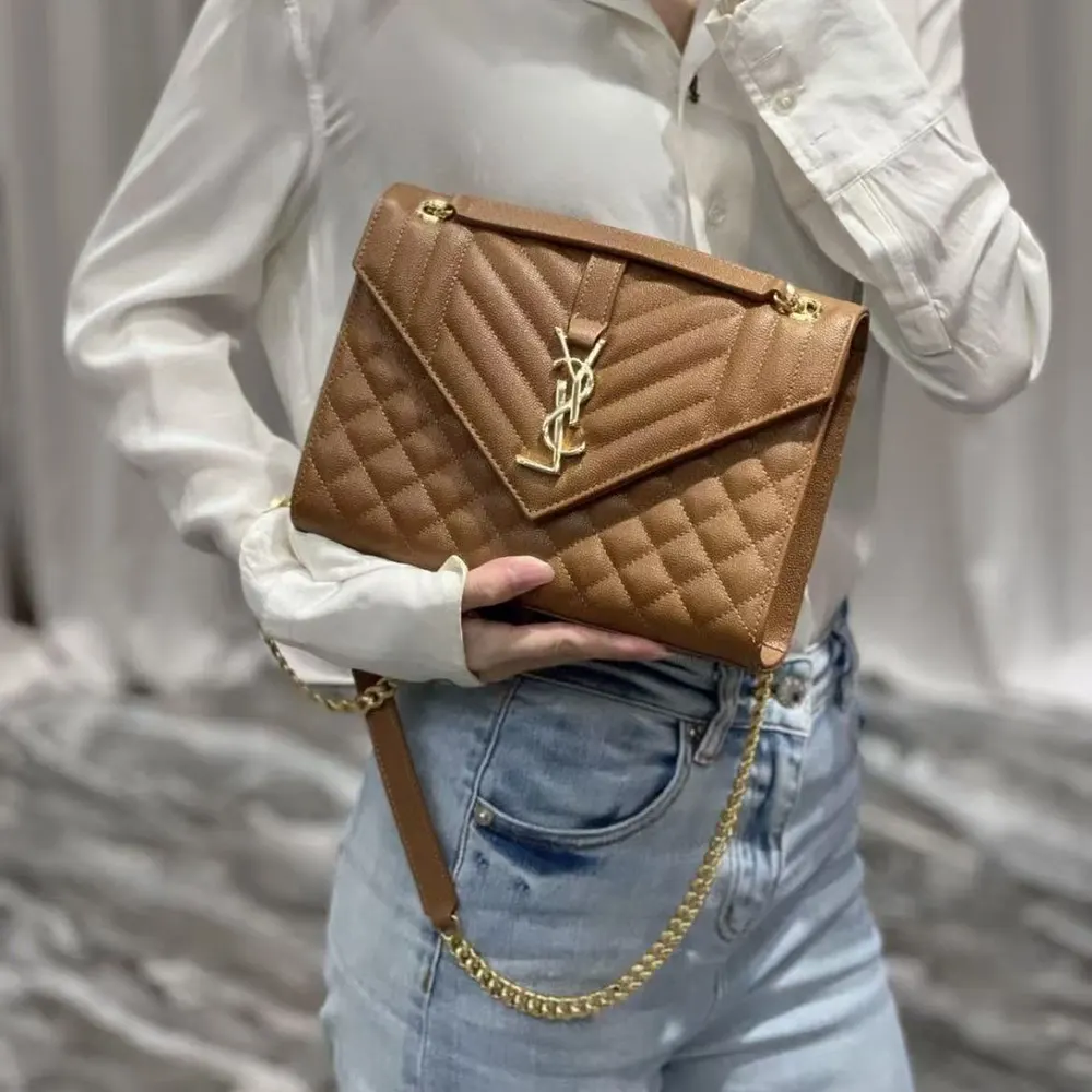 Side angle showing texture and shape of Saint Laurent YSL Medium bag
