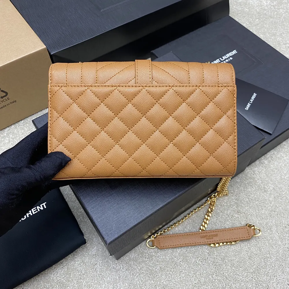 Side angle showing silhouette and flap closure of Saint Laurent YSL Envelope Small