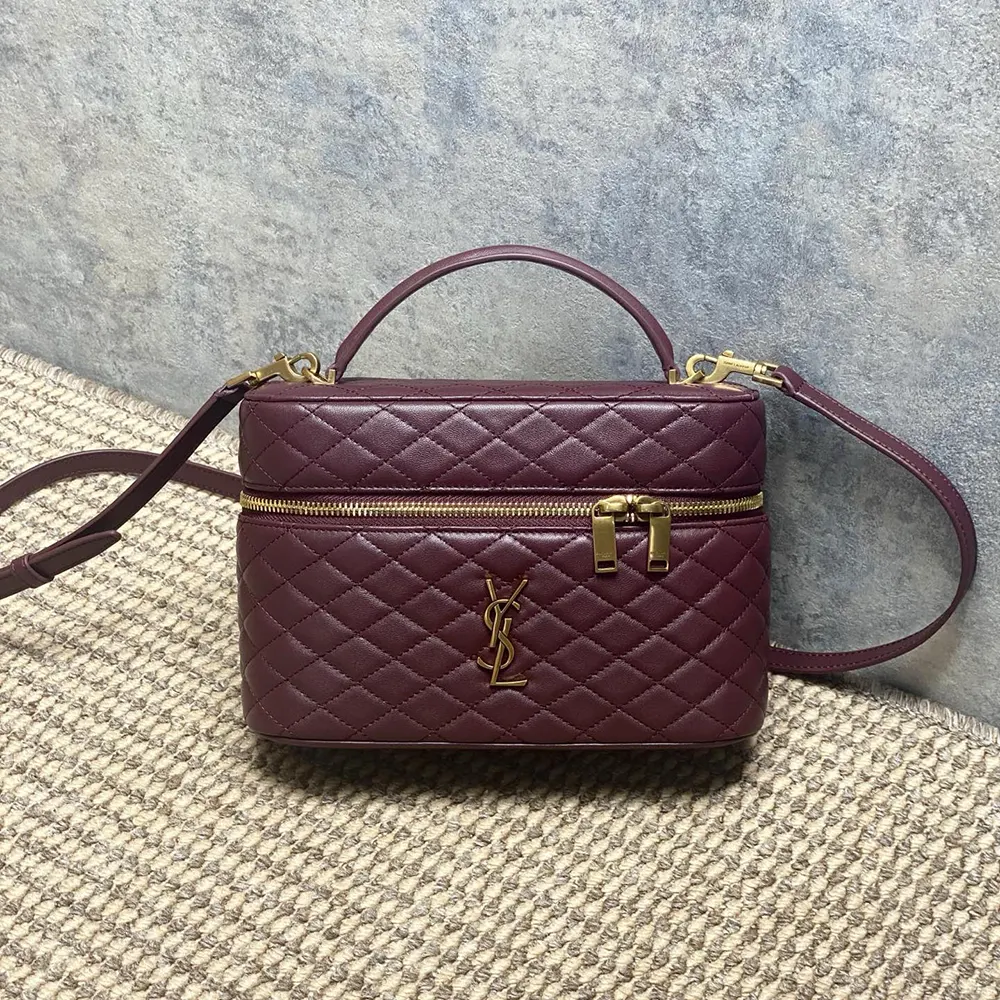 Close-up of gold YSL hardware on Maroon Lambskin Gaby Vanity Bag