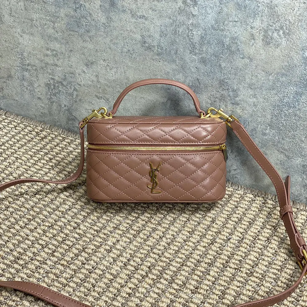 Close-up of gold YSL hardware on the lambskin pink vanity bag