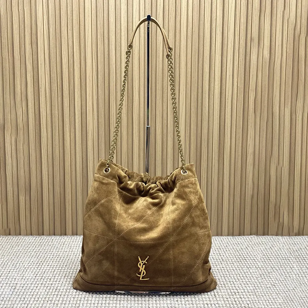Close-up of gold YSL logo hardware on Saint Laurent YSL bag