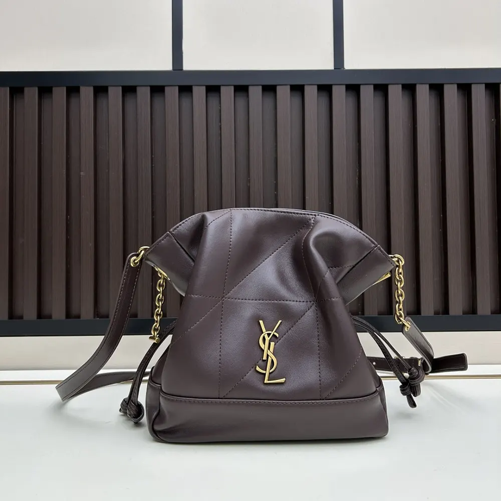 Close-up on gold YSL hardware on Saint Laurent Jamie Mini Shoulder Pouch