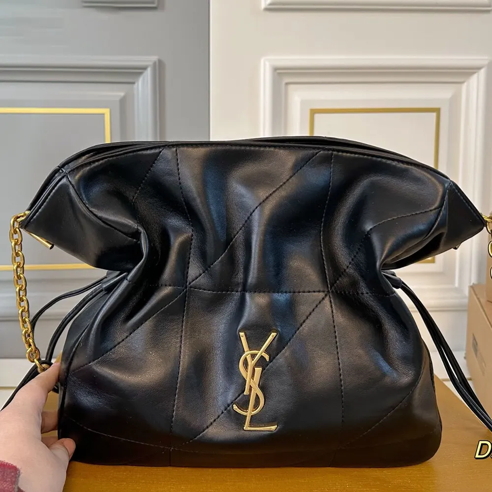 Side angle showing lambskin texture on Saint Laurent YSL Women Jamie Shopping Small