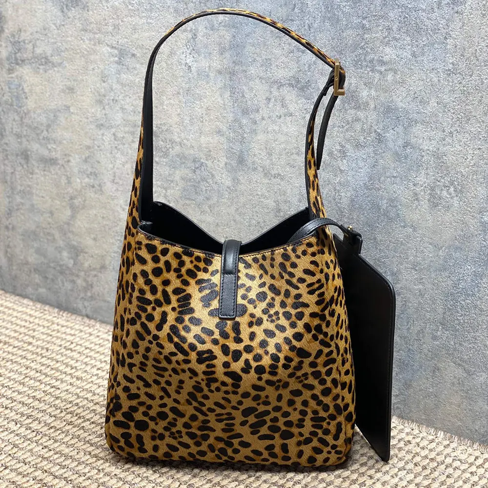 Side angle showing gold YSL hardware on Saint Laurent Women Le 5 À 7 Small bag