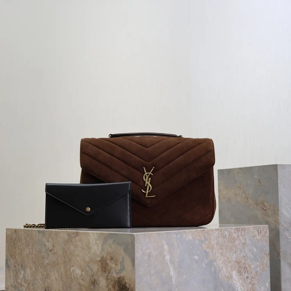 Close-up of gold YSL hardware on Loulou Large brown suede bag