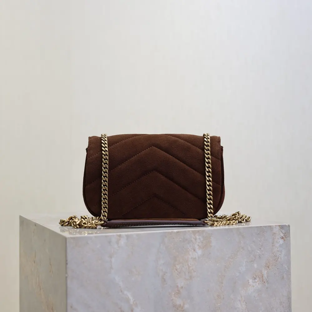 Side angle showing adjustable shoulder strap of YSL Loulou Mini