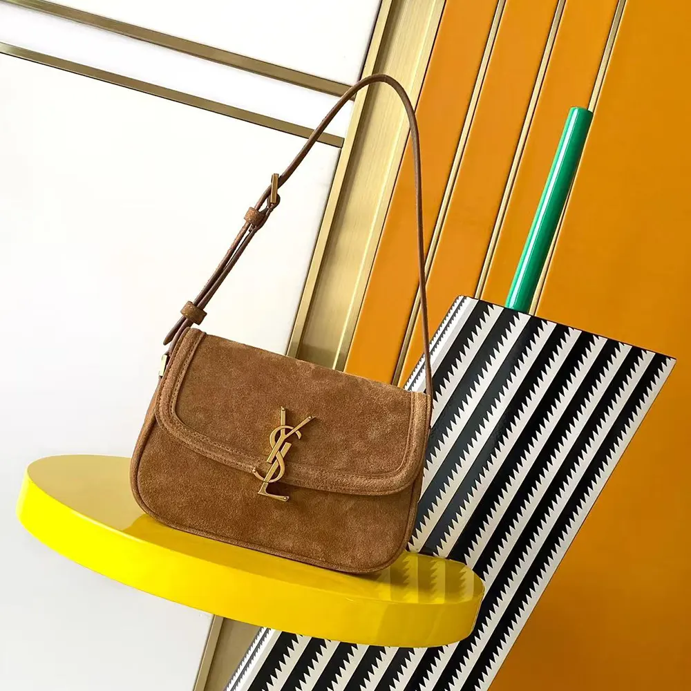 Close-up of gold YSL logo hardware on Solferino Small bag