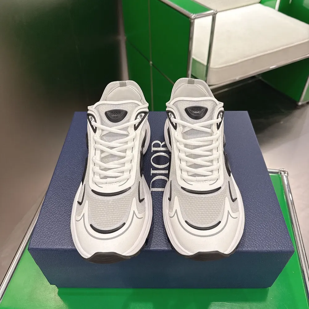 Close-up on laces and signature Dior branding on white semi-transparent sneaker