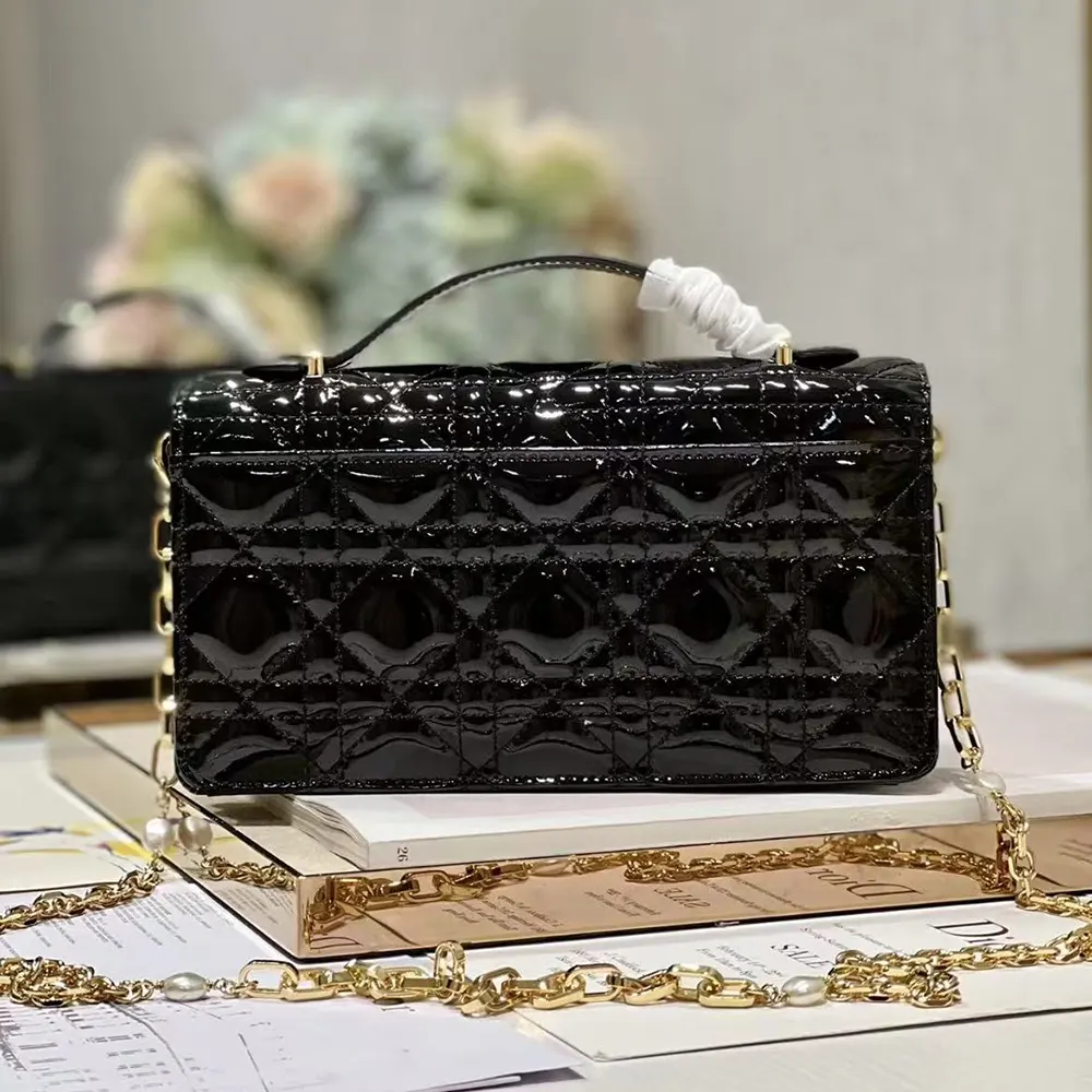 Side angle showing gold hardware on Dior Women My Dior Mini Bag