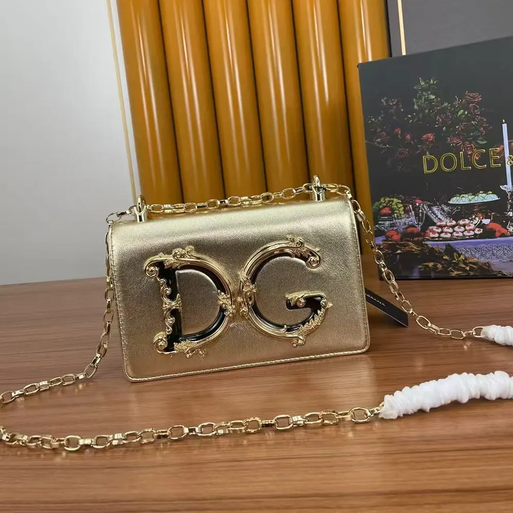 Close-up on gold-tone D&G hardware and zipper on phone bag