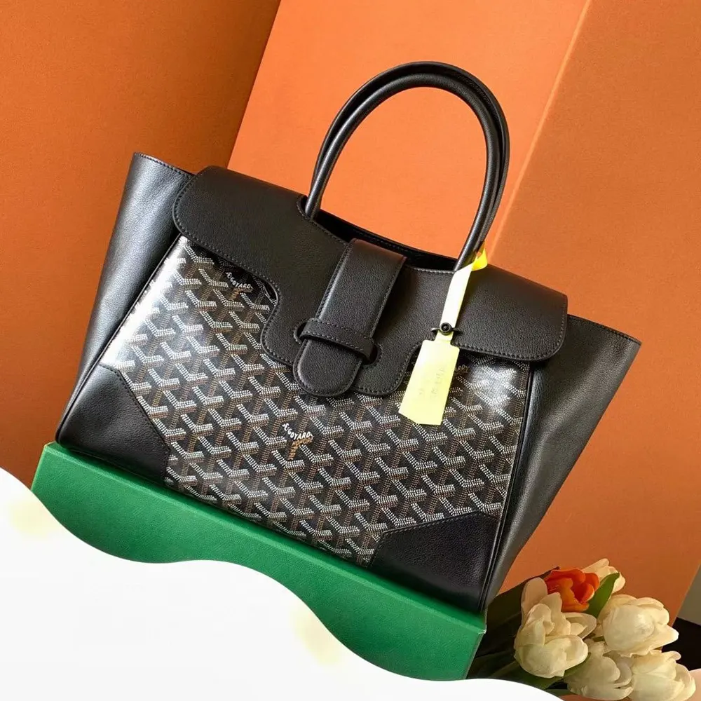 Close-up of gold-tone hardware and leather trim on Goyard Saïgon Tote
