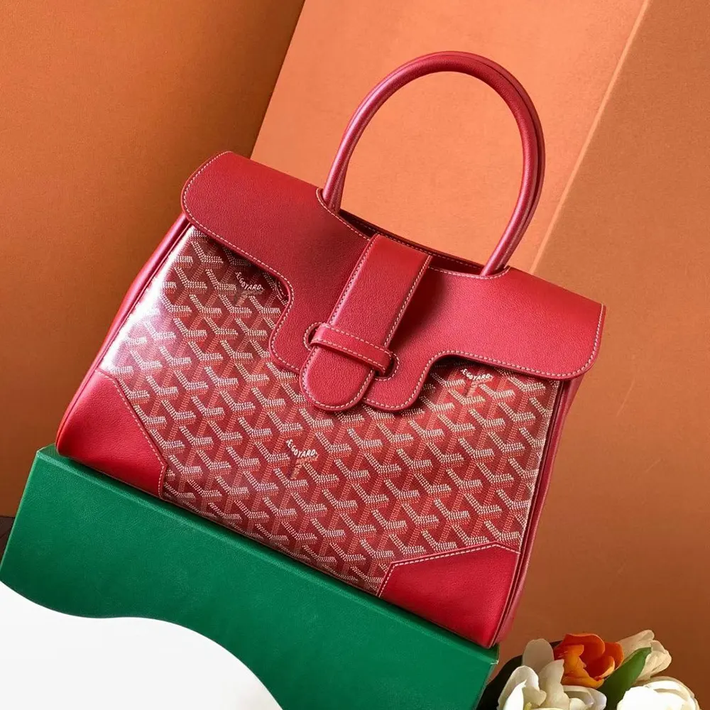 Side angle of Goyard Women Saïgon Tote Bag-Red displaying spacious silhouette