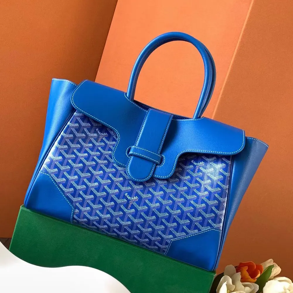 Side angle of Goyard Women Saïgon Tote Bag-Sky Blue highlighting textured canvas