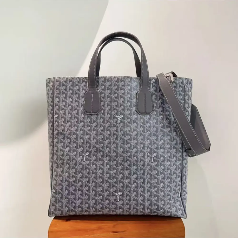Close-up of Goyardine canvas pattern and silver hardware on Voltaire Tote