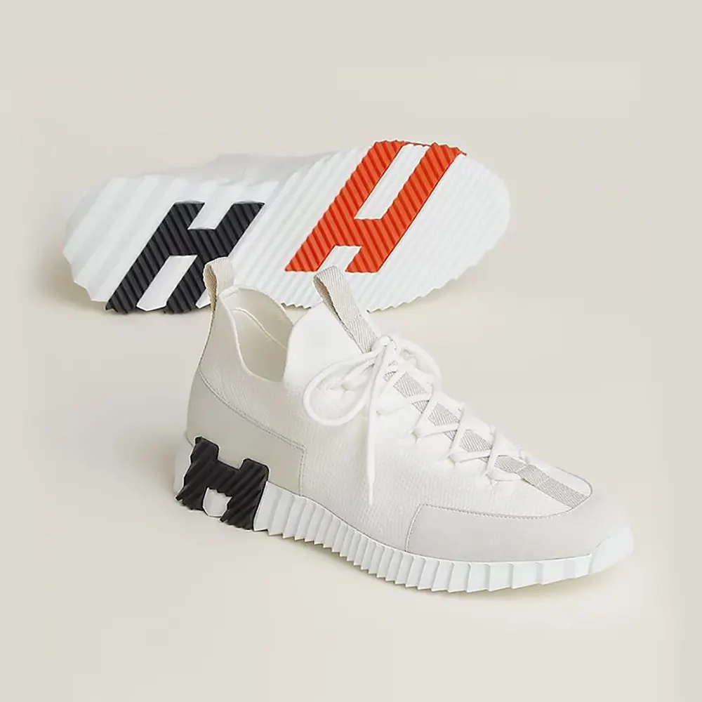 Side angle of Hermes Unisex Lift Slip-on Sneaker-White showing clean silhouette