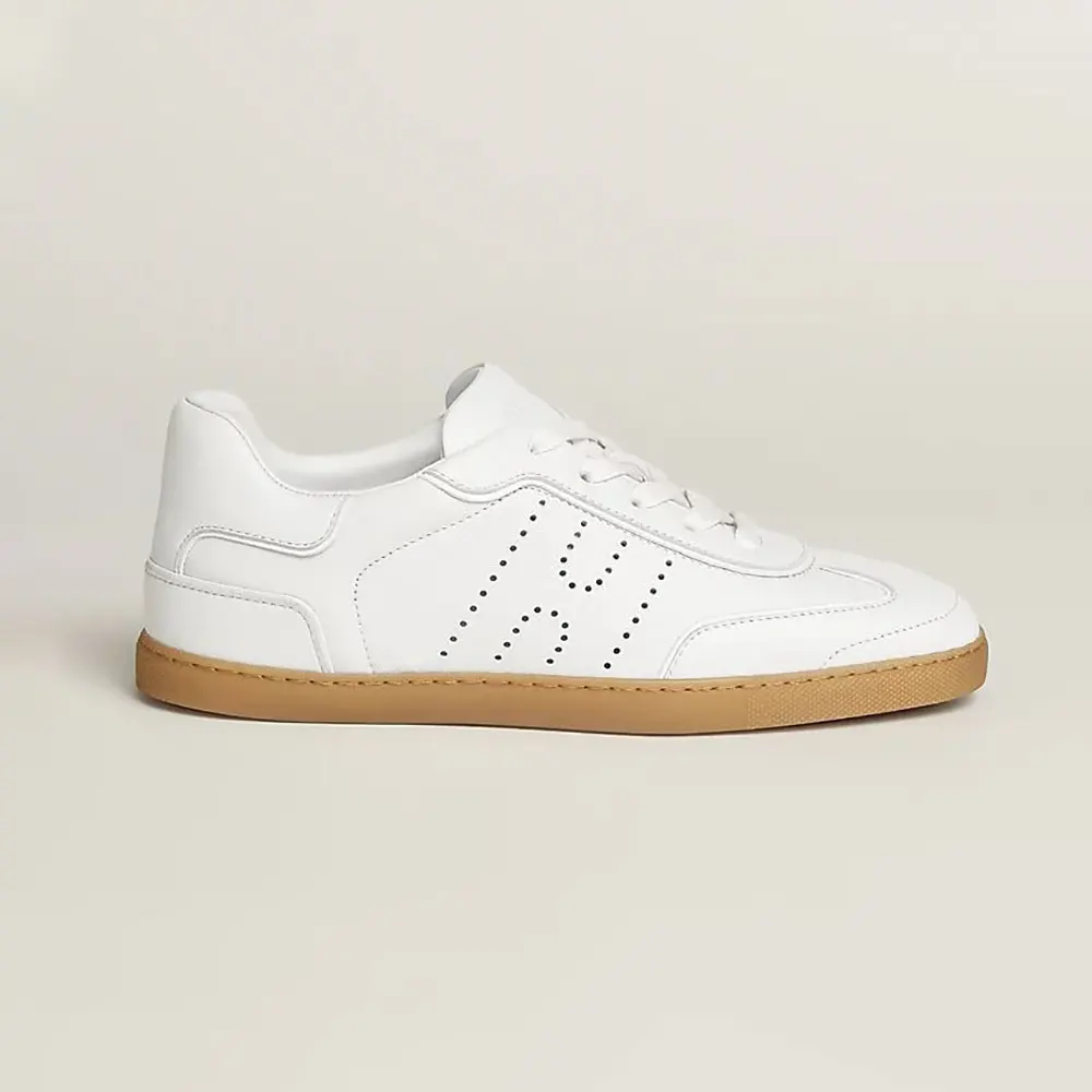 Side profile of Hermes Unisex Match Sneaker in white leather