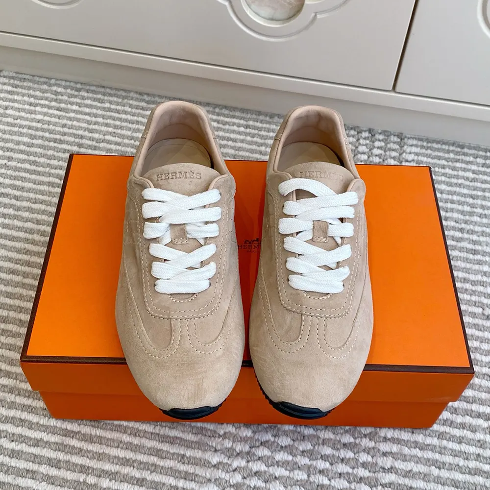 Close-up on brown suede texture and lace details of Hermes Unisex May Derby Shoe