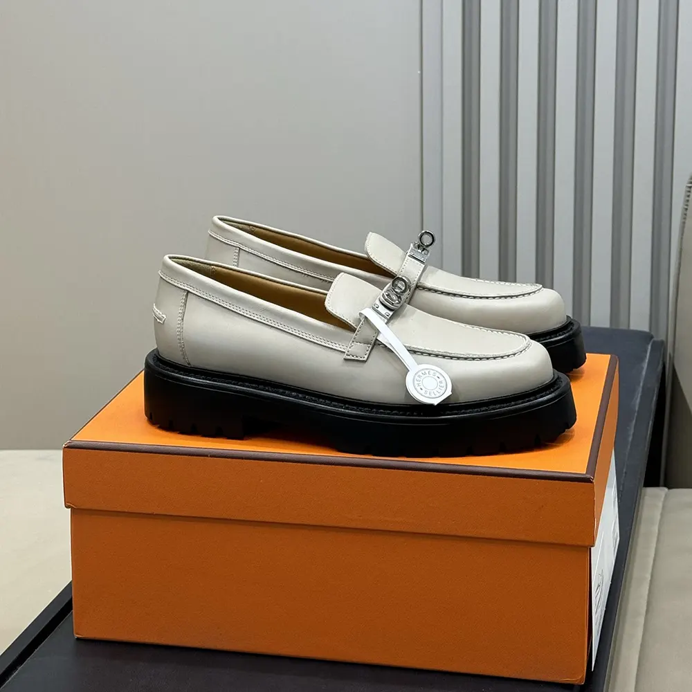 Close-up detail of gray calfskin leather and Hermes metallic bit