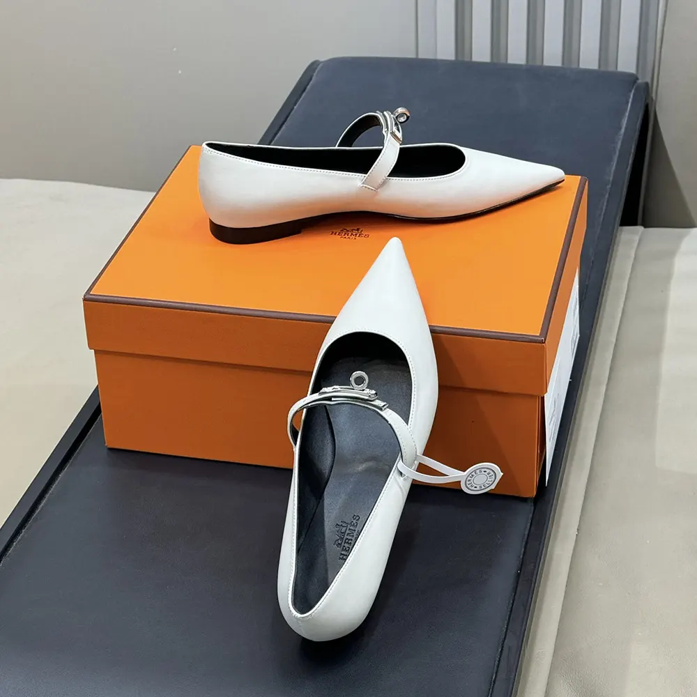 Top-down view of smooth white leather Hermes Kelly Ballet Flat