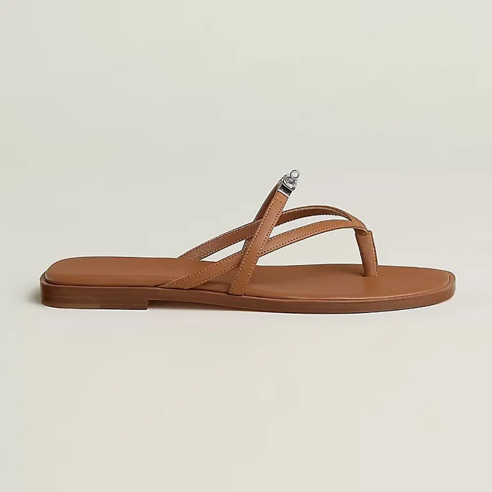 Side profile of Hermes Women Miss Sandal in Calfskin-Brown showing silhouette
