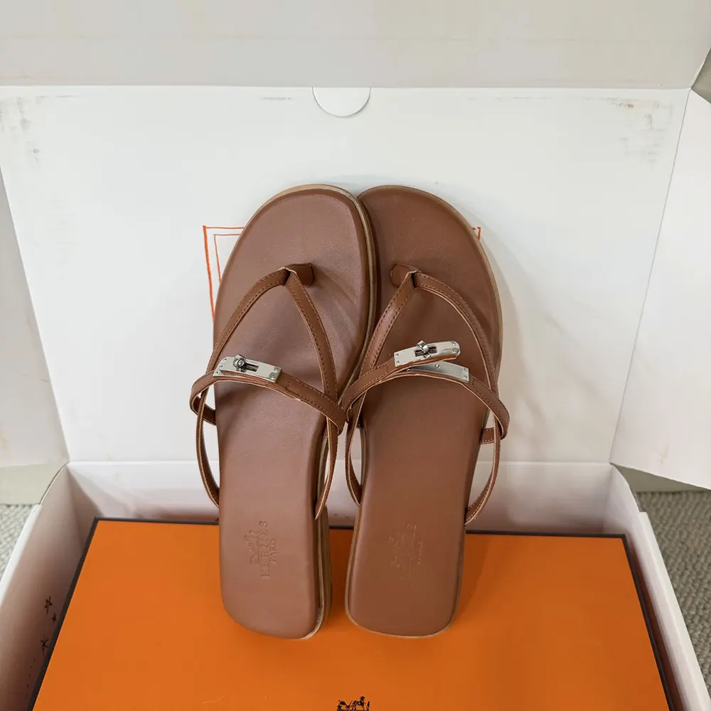Overhead view of Hermes Women Miss Sandal highlighting leather texture