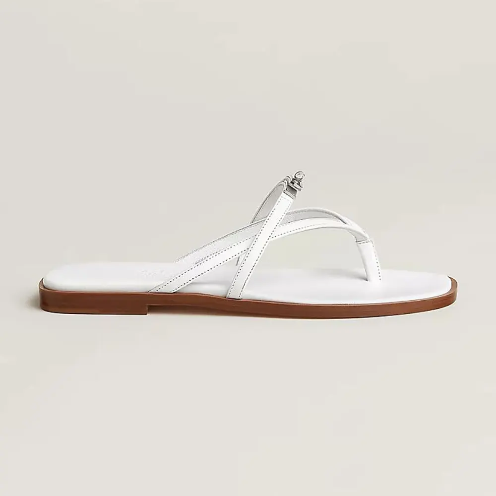 Side view of Hermes Women Miss Sandal in Calfskin-White showing sleek silhouette