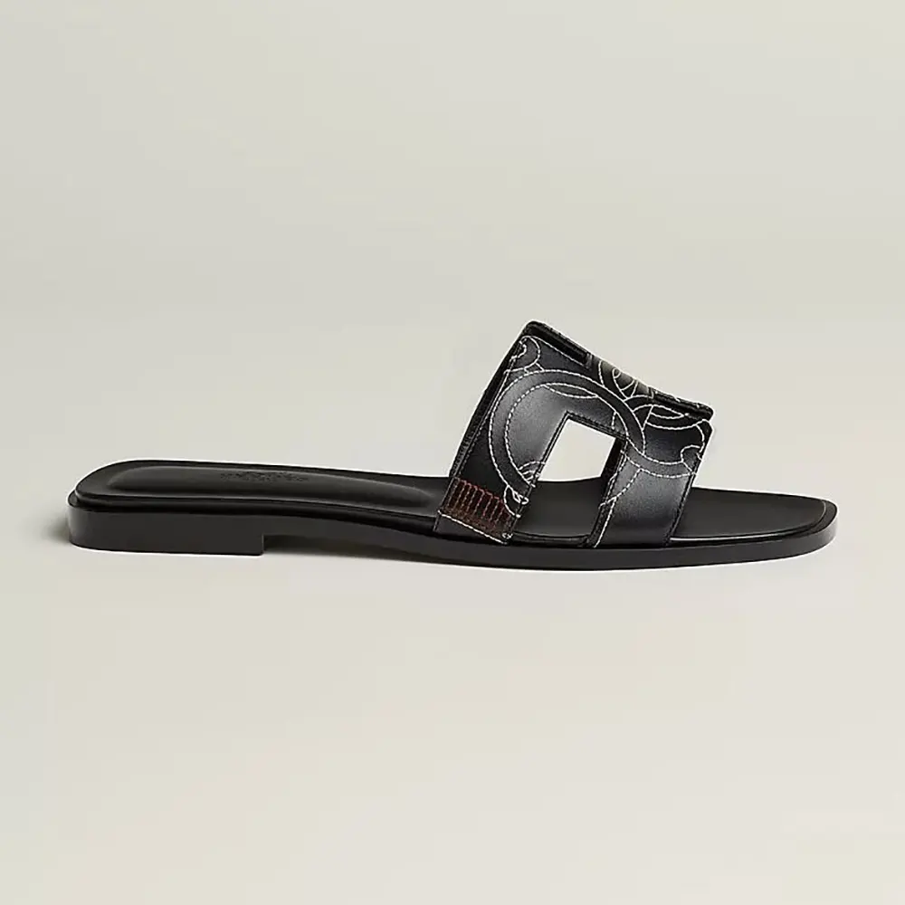 Side profile of Hermes Women Oran sandal with embroidered calfskin black