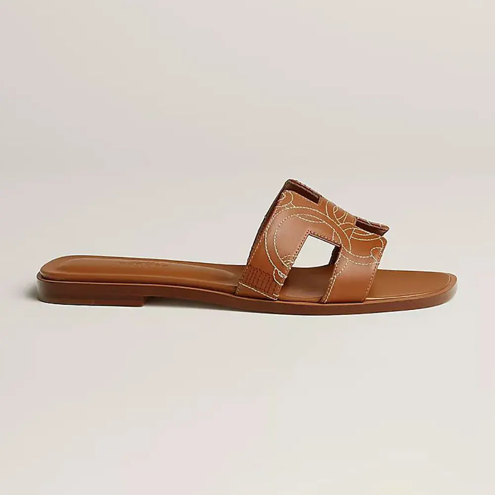 Side view of Hermes Women Oran sandal in embroidered brown calfskin