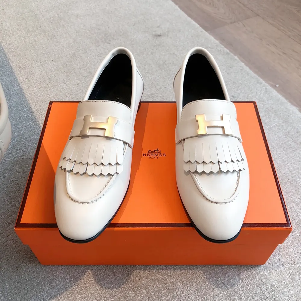 Close-up of white calfskin leather texture on Hermes Women Royal loafer