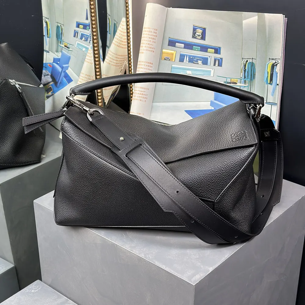 Close-up of grained leather texture and silver hardware on Loewe Puzzle Edge Bag